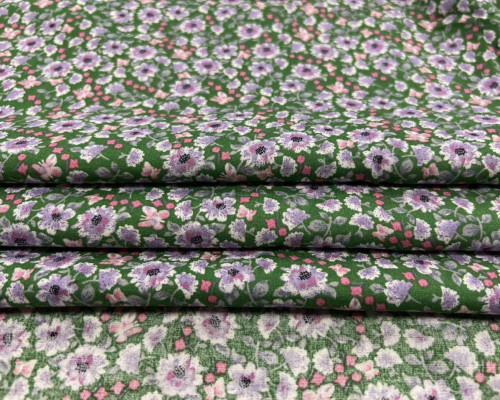 Viscose fabric purple flowers in green - 1