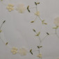 Embroidered tulle with flowers White pigiau