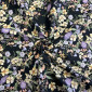 Cotton fabric with elastane Yellow flowers in black