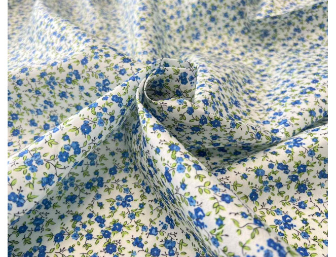 Dress fabric Blue flowers in white internetu