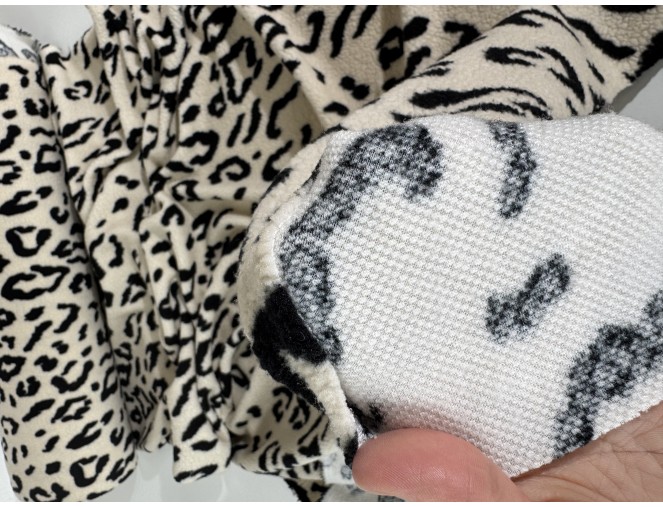 Teddy fabric with leopard print in cream, 320 g/sq m. pigiau
