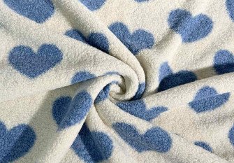 Teddy fabric Blue hearts on cream background